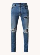 AMIRI Skinny jeans met gekleurde wassing en destroyed afwerking