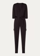 Claudia Sträter Tapered fit jumpsuit met steekzakken en strikceintuur