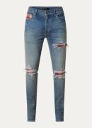 AMIRI MX1 skinny jeans met medium wassing en destroyed afwerking